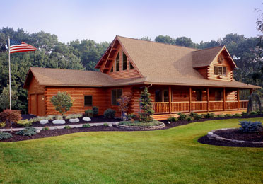 Log home with large porch and gabled roof