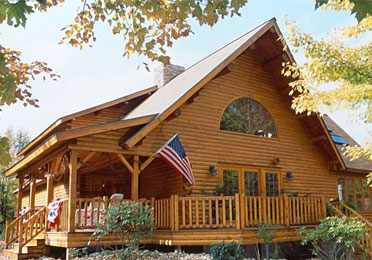 Log home with porch and American flag