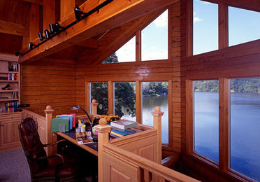 Study room with large windows overlooking lake