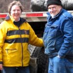 Jane and Marcus Sharpe standing outdoors in casual clothing.