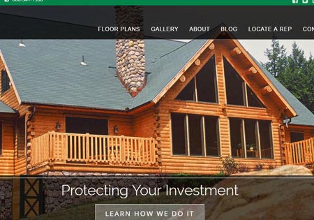 Large cedar log home with stone chimney and balcony