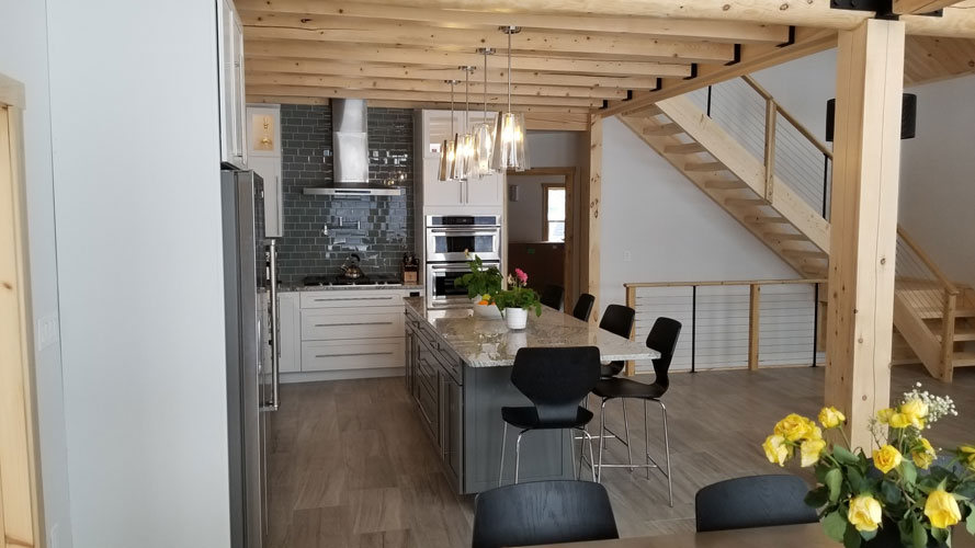 Modern kitchen with island and wooden beams