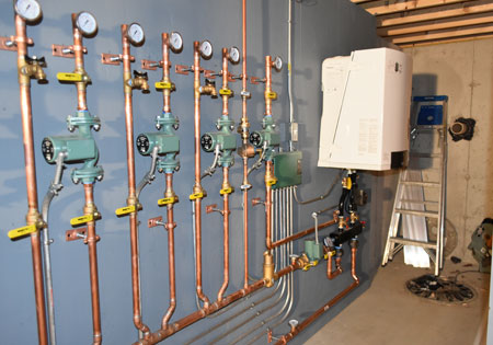 Copper pipes and gauges in a mechanical room