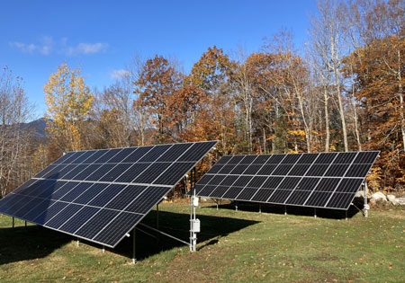 Two ground-mounted solar panels in a field
