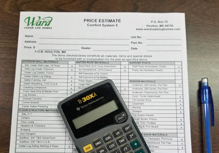 Price estimate for building a Ward Cedar log home with calculator and pen