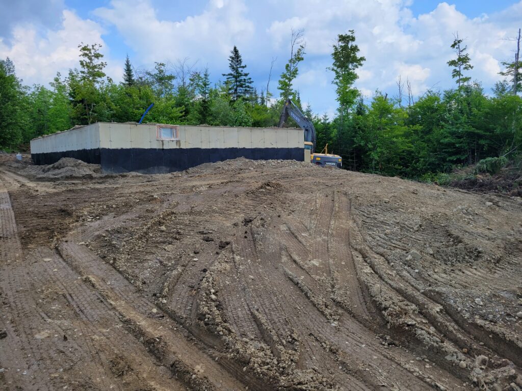 Construction site with foundation and cleared land